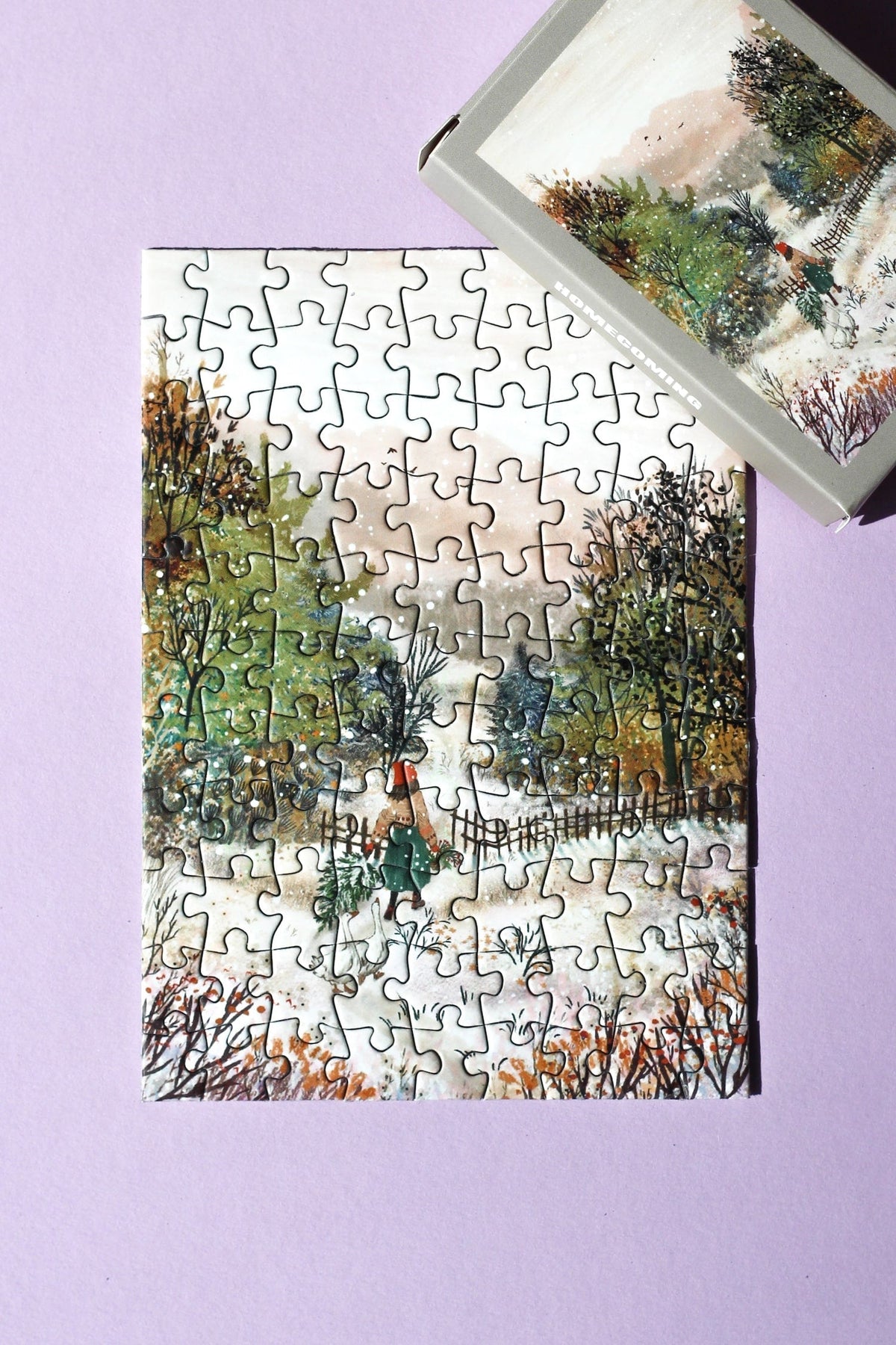 Fertig gelegtes Minipuzzle Homecoming mit passender Schachtel oben rechts